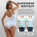 Dettaglio body modellante bianco con pizzo e schiena scoperta per il controllo dell'addome - S / Bianco