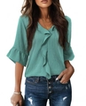 Detailed view of teal V-neck blouse with ruffle trim and 3/4 lantern sleeves texture - Green