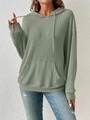 Detail of sage green ribbed knit hoodie featuring drawstring hood and kangaroo pocket - S / Green