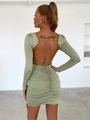 Detailed view of the backless sage green mini dress with ruched texture and tie-up design - S / Sage Green