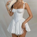 Detailed view of white corset dress featuring delicate lace trim and ribbon bow neckline - S / White