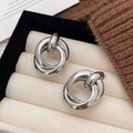 Minimalist silver interlocking twist knot earrings with polished metallic finish - Silver