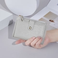 Slim silver glitter card holder with metallic gold button and secure top zipper closure - Gray