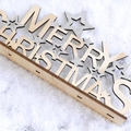 Wooden Merry Christmas tabletop ornament with silver glitter stars on a snowy background - Natural Wood Silver Stars - Stand Ornament