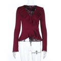 Close-up of deep red V-neck top showing ruffle trim and soft knit fabric texture - S / Burgundy
