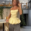 Elegant light yellow satin peplum camisole with thin straps and ruffled hem design - S / Tops / Yellow
