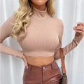 Detail of apricot ribbed knit crop top featuring a mock neck and slim-fit long sleeves - S / Rose Gold