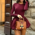 Detail showing elegant long sleeve bodycon dress in wine red with vintage bamboo handle bag - S / Dark Red