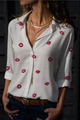 Detail of pink lipstick kiss prints on white long sleeve button-up shirt for women - S / Red Lip Print Style (NZ2401-01)