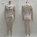 Detail of gray velvet dress showing draped neckline, ruched waist, and rhinestone buckle - Dresses / S / Gray