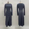 Detail of the elegant knot waist and wrapped skirt design on a grey long-sleeved dress - S / Dresses / Gray