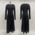 Detail of waist knot and pleated drapes on this black long sleeve wrap maxi dress - S / Dresses / Black