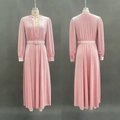 Detail view of pink velvet dress with rhinestone buckle belt and V-neckline texture - S / Pink
