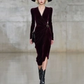 Detail of burgundy velvet dress featuring elegant V-neck with black lace trim and vintage brooch - S / Dark Red