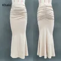 Detail of khaki high waist mermaid skirt showing horizontal pleats and fishtail hem - S / Bottoms / Khaki