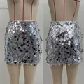 Close-up of sparkling silver sequins on high-waisted mini skirt with metallic texture - S / Bottoms / Silver