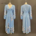 Detailed view of light blue V-neck dress with pink floral patterns and long elastic sleeves - S / Dresses / Light Blue