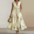 Detail of elegant V-neck sleeveless pleated dress with floral patterns and gold belt - S / Yellow