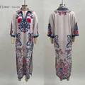 Detailed front and back views of white V-neck kaftan maxi dress with ethnic flower prints - S / Dresses / Patterned