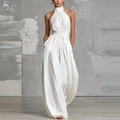 Detail of white halter neck jumpsuit showing linen-like pleated texture and wide leg cut - S / Halter Jumpsuit / White