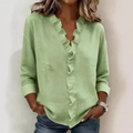 Detailed close-up of ruffle V-neckline on light green linen blouse for women - S / Tops / Light Green