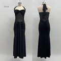 Détail de robe noire dos nu montrant la texture en tulle froncé et les longs liens de cou - S / Robes / Noir