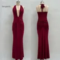 Front and back view of burgundy deep V neck backless halter maxi dress with pleated fabric - Burgundy