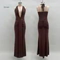 Detailed front and back view of brown halter neck dress with deep V-neck and pleats - Coffee