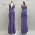 Detail of purple halter neck maxi dress featuring deep V-neck and ruched mermaid silhouette - Purple