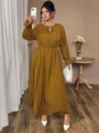 Detail of plus size polka dot dress showing tie neckline and elastic ruffled cuffs - Yellow
