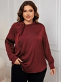 Close-up of wine red satin blouse featuring a knot detail on the elegant stand collar - Burgundy