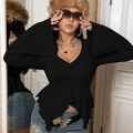 Women's black V-neck top featuring dramatic bell sleeves and a ruffled irregular hemline - 1XL / Black