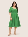 Close-up of green puff sleeve dress with square neck, lace-up detail and smocked waistline - 1XL / Green