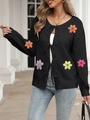 Detail of black knit cardigan featuring colorful crochet flowers and chic ribbon bow ties - S / Tops / Black