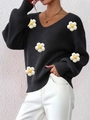 Detailed close-up of 3D knit floral applique and V-neckline texture on black sweater - S / Tops / Black