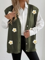 Detail view of dark green knit vest featuring white daisy appliques and pearl buttons - One Size / Army Green