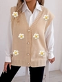 Close-up of beige knit vest featuring elegant pearl buttons and 3D floral appliqués - One Size / Apricot