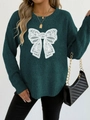 Close-up of white lace bow embroidery on a dark green crewneck knitted sweater - S / Tops / Dark Green