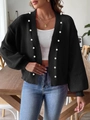 Detail of white pearl embellishments on a black knit cardigan with ribbed texture - S / Black