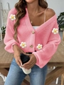 Detailed view of pink knitted cardigan with 3D white crochet flowers and buttons - S / Pink