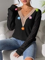 Detailed close-up of V-neck lace patchwork and colorful crochet floral knit embroidery - S / Tops / Black