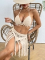 Detail of crochet beach cover-up featuring natural shells and long tassel fringe - Apricot