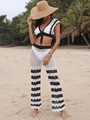 Close-up of bohemian crochet knit texture on a black and white beach set with wavy stripes - S / Top And Bottom / White