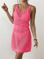 Detail of hot pink crochet knit dress featuring round hollow cutouts and ribbed waist - Rose Red