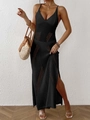 Detail of black knit maxi dress with geometric cutouts and side slit for beach vacation - One Size / Black