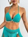 Detailed view of handmade crochet bikini top featuring authentic white shell pendants - One Size / Green
