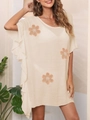 Detail of ruffle sleeves and crochet flower appliques on a beige beach cover-up dress - Apricot