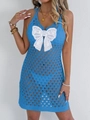 Detail view of electric blue crochet dress featuring a large white lace butterfly bow - Blue
