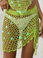 Detail of green crochet mini skirt with shimmering sequins and side drawstring tassel - One Size / Bottoms / Green