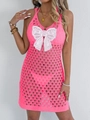 Detail of hot pink crochet beach cover-up with a white lace butterfly applique - Rose Red